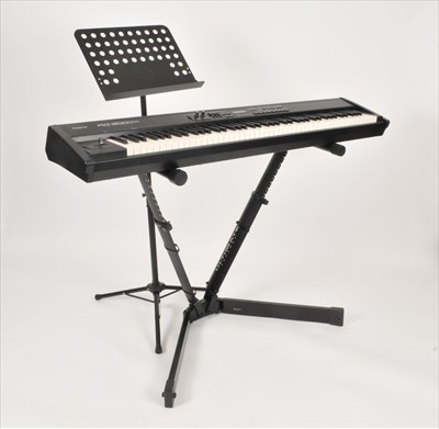 Lot 523 - A Roland RD-300GX keyboard and accessories