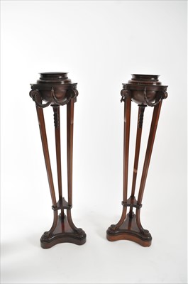 Lot 696 - A pair of 19th century mahogany trefoil torcheres in the Adam style