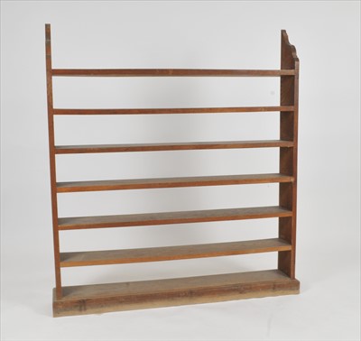 Lot 546 - An early 20th century free-standing seven tier bookcase