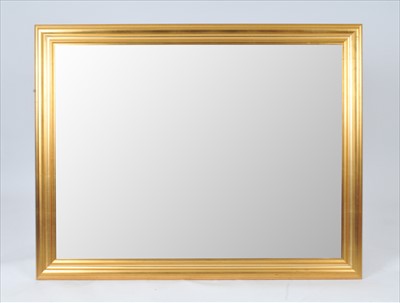 Lot 566 - A large contemporary gilt framed wall mirror