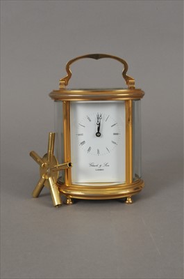 Lot 536 - A glazed brass cased carriage clock