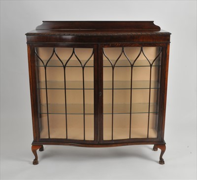 Lot 634 - An early 20th century oak display cabinet