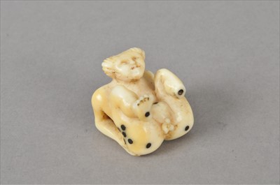 Lot 492 - A small Japanese Meiji period carved ivory erotic figural ivory dice