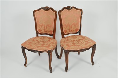 Lot 396 - A set of eight upholstered walnut framed dining chairs in the French style