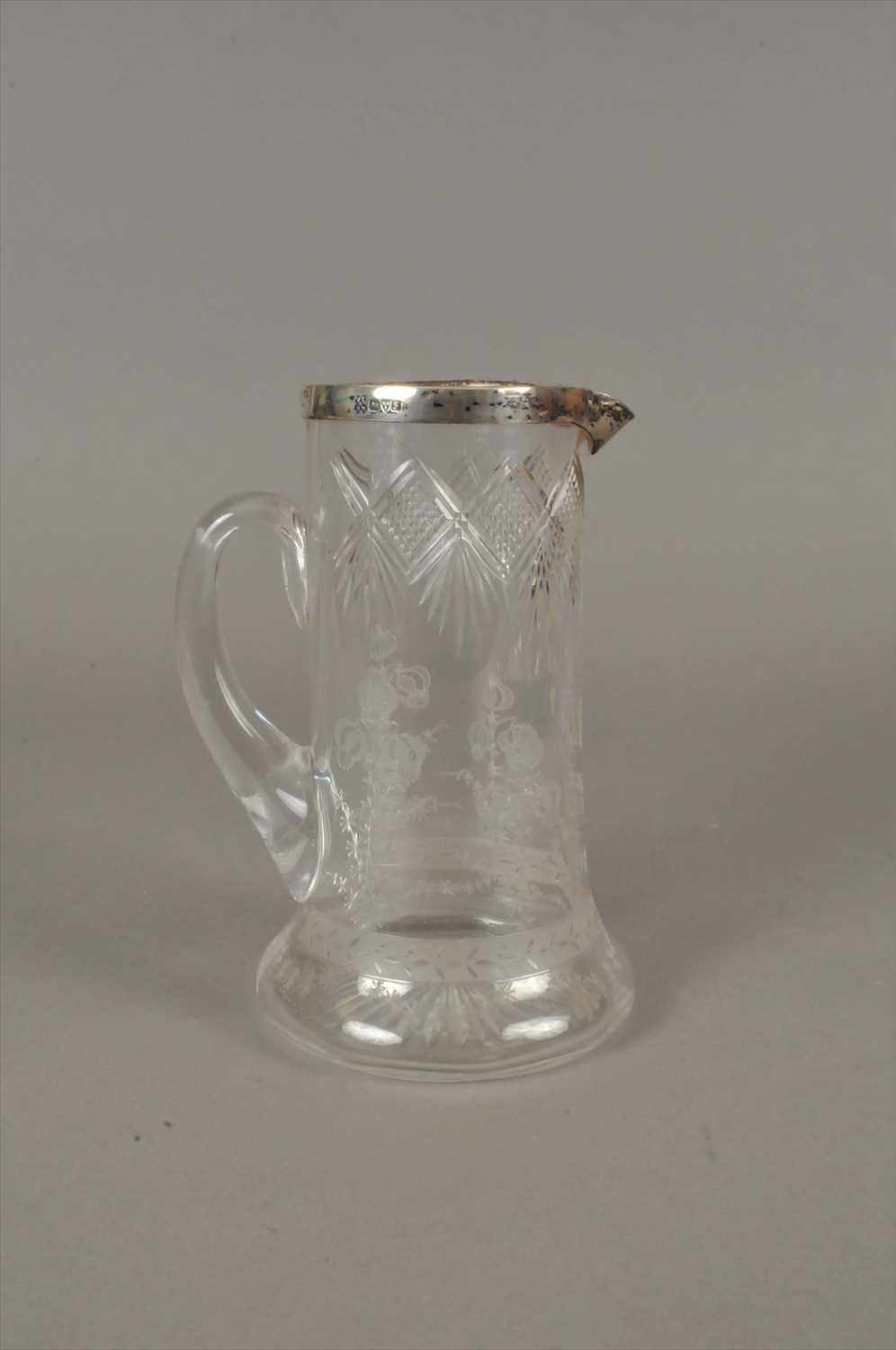 Lot 34 - A silver mounted etched glass jug