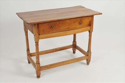 Lot 337 - A Continental pale oak side table, with a...