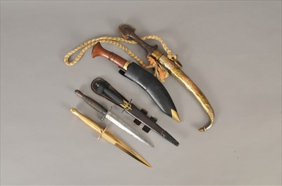 Lot 283 - Three reproduction commando knives, a kukri and a Middle Eastern dagger