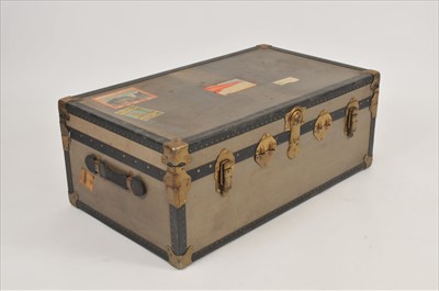 Lot 560 - A large 20th century bound and studded cabin / steamer trunk, with travel labels