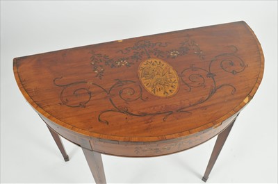 Lot 621 - A 19th century mahogany veneered inlaid and pen worked demi lune card table