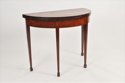 Lot 586 - A 19th century mahogany veneered demi-lune card table