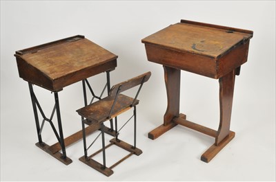 Lot 558 - Three 20th century pine school desks, one with an associated chair