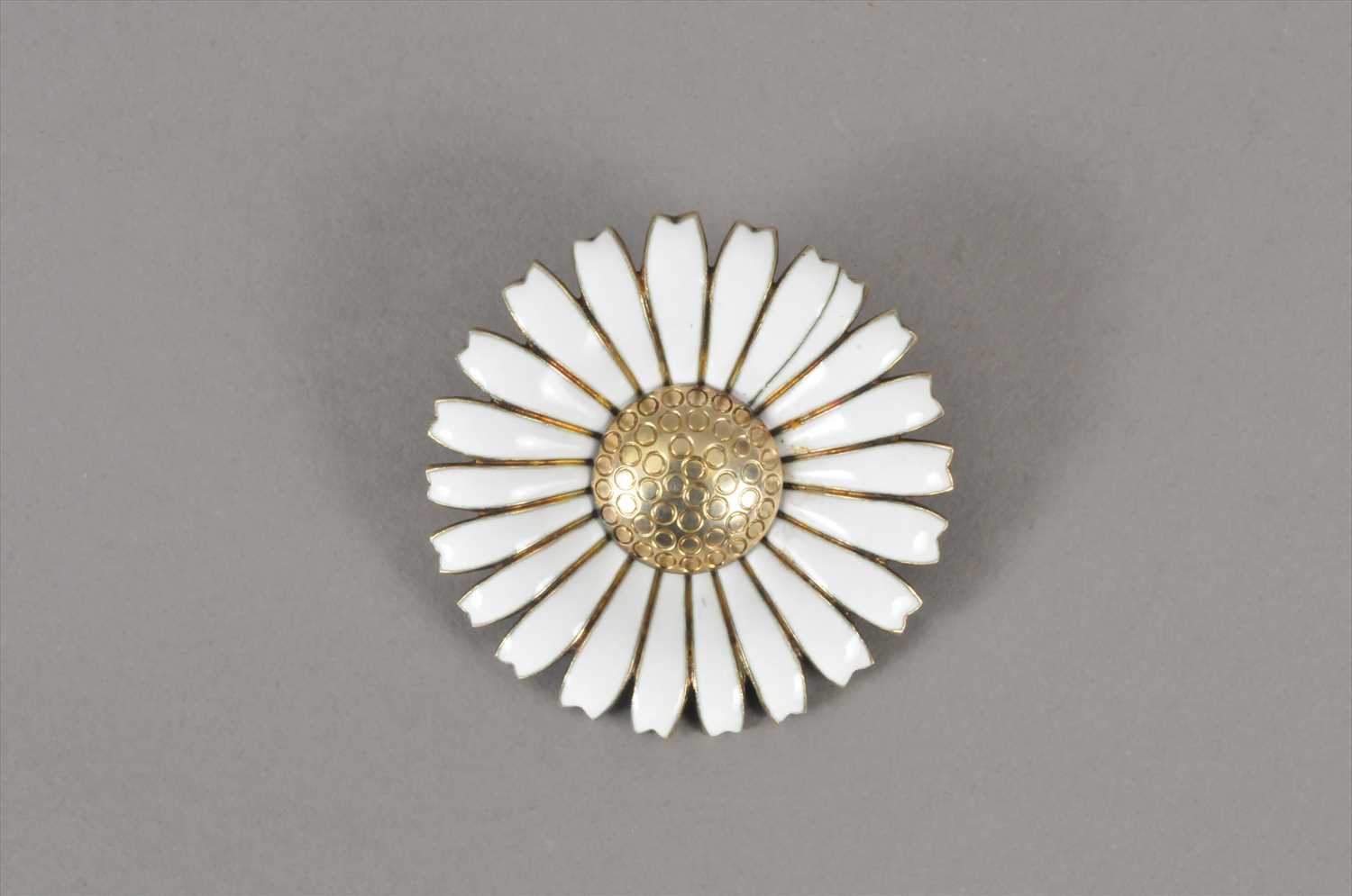 Lot 65 - A Georg Jensen silver and white enamel daisy brooch