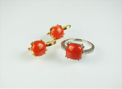 Lot 62 - A coral and diamond ring and a pair of coral earrings