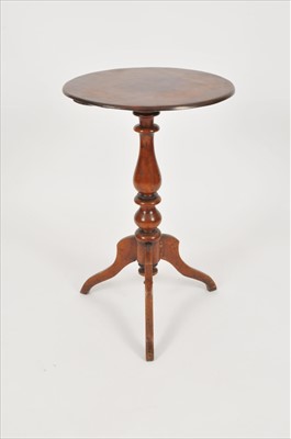 Lot 580 - A small mahogany tripod occasional table