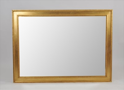 Lot 605 - A large contemporary gilt framed wall mirror