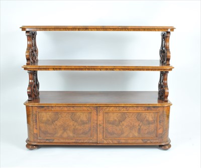 Lot 317 - A Victorian walnut three tier buffet