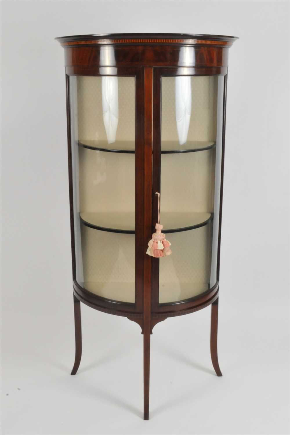 Lot 320 - An Edwardian mahogany demi-lune glazed display cabinet
