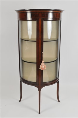 Lot 320 - An Edwardian mahogany demi-lune glazed display cabinet