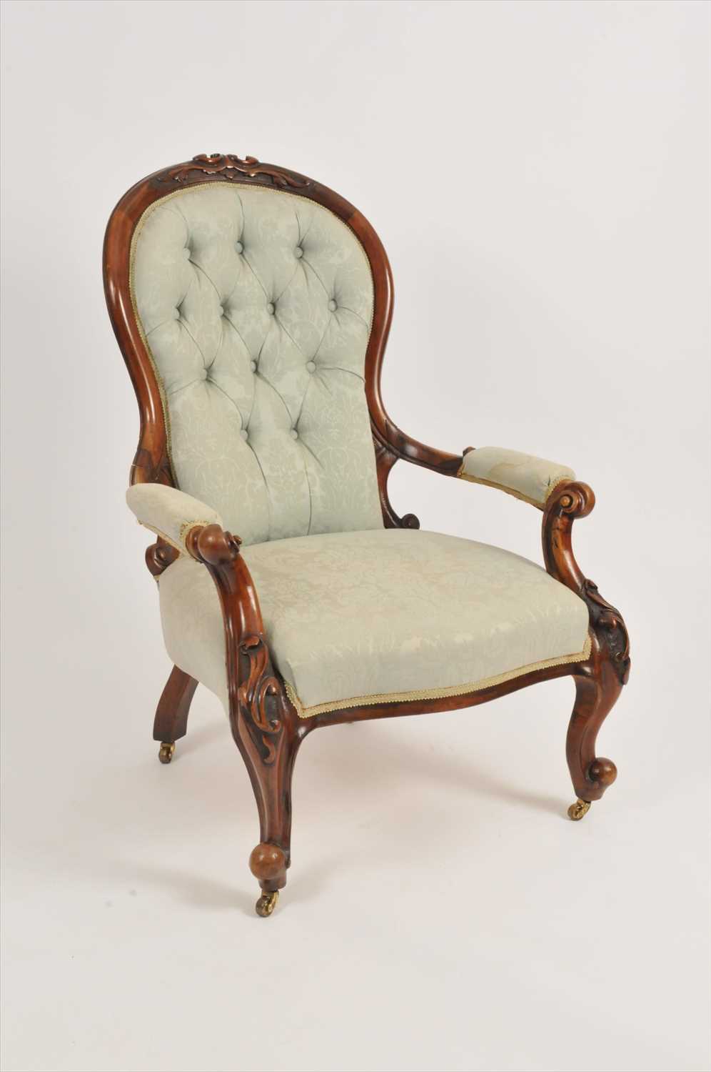 Lot 322 - A Victorian mahogany framed upholstered spoon back armchair