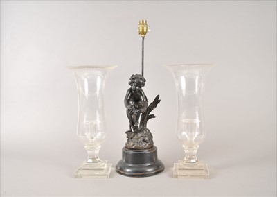 Lot 1 - A pair of tall clear cut glass storm lanterns and a bronzed figural table lamp