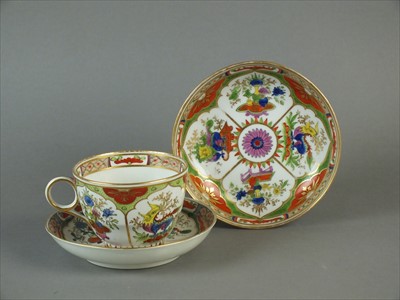 Lot 470 - Worcester 'Dragons in Compartments' teacup and two saucers