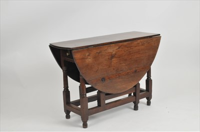 Lot 359 - A 19th century oak gateleg dining table