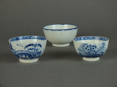 Lot 320 - Three Caughley blue and white tea bowls, circa 1785
