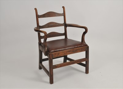 Lot 369 - A late 19th century oak arm chair