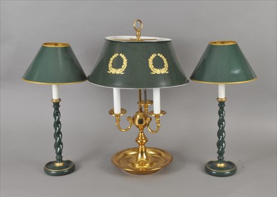Lot 298 - A reproduction three light brass desk lamp and a pair of painted barley twist candlesticks