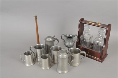 Lot 216 - A small collection of antique pewter tankards and a reproduction two decanter Tantalus.