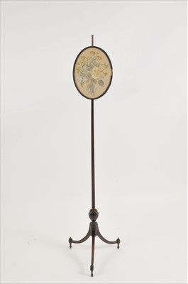 Lot 561 - A 19th century mahogany tripod pole screen