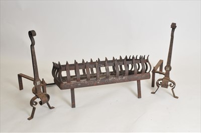 Lot 302 - A very large and heavy ironwork fire basket and fire dogs
