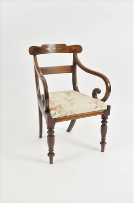 Lot 401 - A regency walnut framed armchair inlaid with strung brass borders and further inlaid motifs