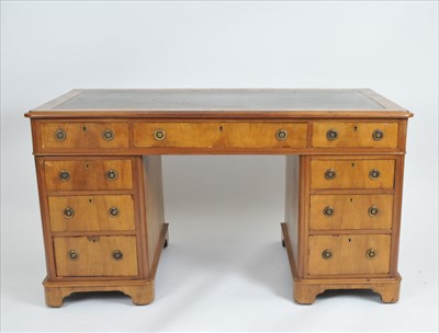 Lot 417 - An early 20th century walnut veneered pedestal desk