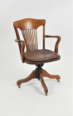 Lot 425 - An early 20th century walnut spinning office / captain’s chair