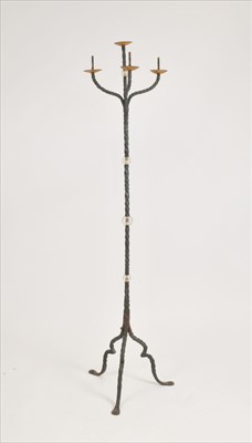 Lot 410 - A decorative tall patinated wrought iron four divisional candle standard