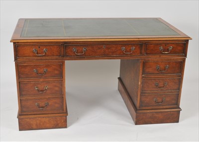Lot 411 - A burr walnut veneered pedestal desk
