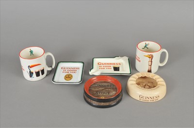 Lot 141 - Four Guinness ash trays and two Guinness mugs