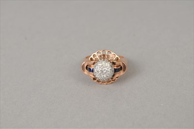 Lot 397 - A diamond and sapphire dress ring