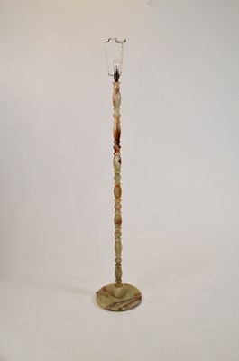 Lot 327 - A free-standing turned onyx standard lamp