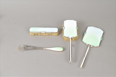 Lot 359 - An Art Deco four piece silver and enamel mounted dressing set