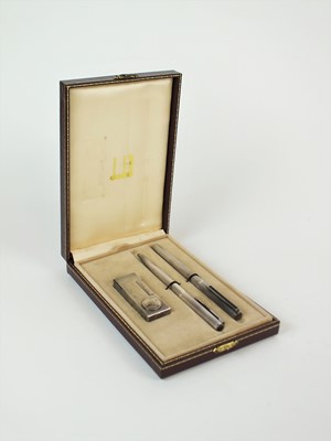 Lot 138 - A commemorative Dunhill cased lighter, fountain pen and biro set