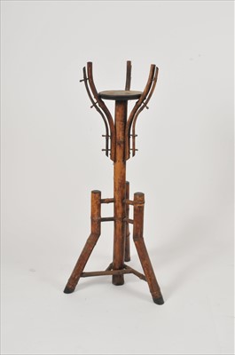 Lot 485 - A decorative cut bamboo jardinière or lamp standard
