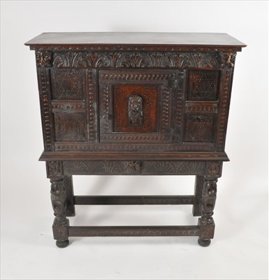 Lot 576 - An 18th century and later oak chest on stand