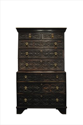 Lot 554 - A later carved country oak chest on chest