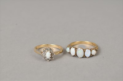Lot 402 - Two 9ct gold opal rings