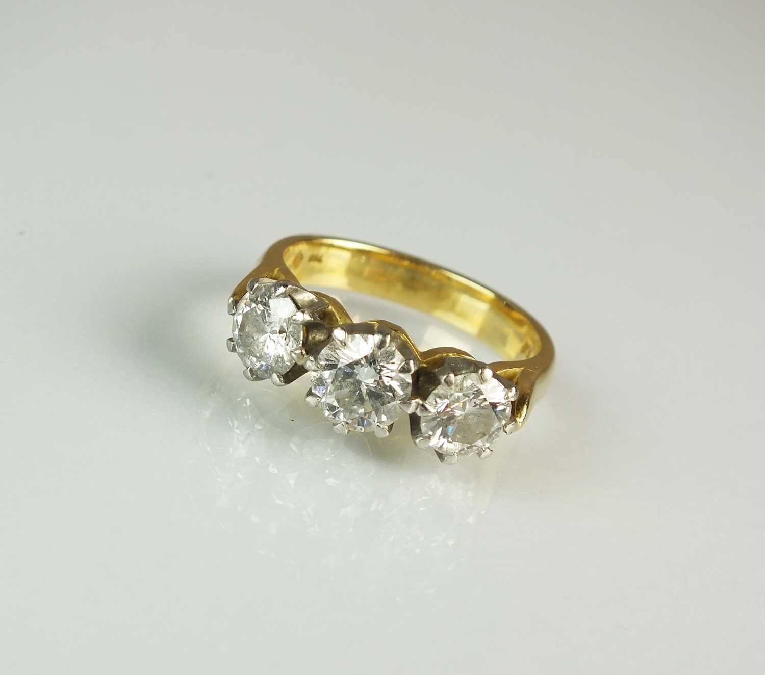 76 - A three stone diamond ring