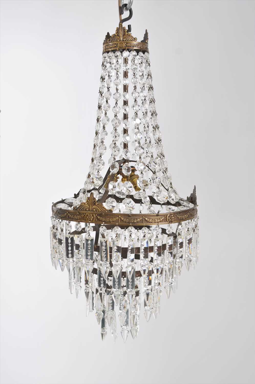 Lot 656 - An early 20th century three tier cascading drop ceiling chandelier