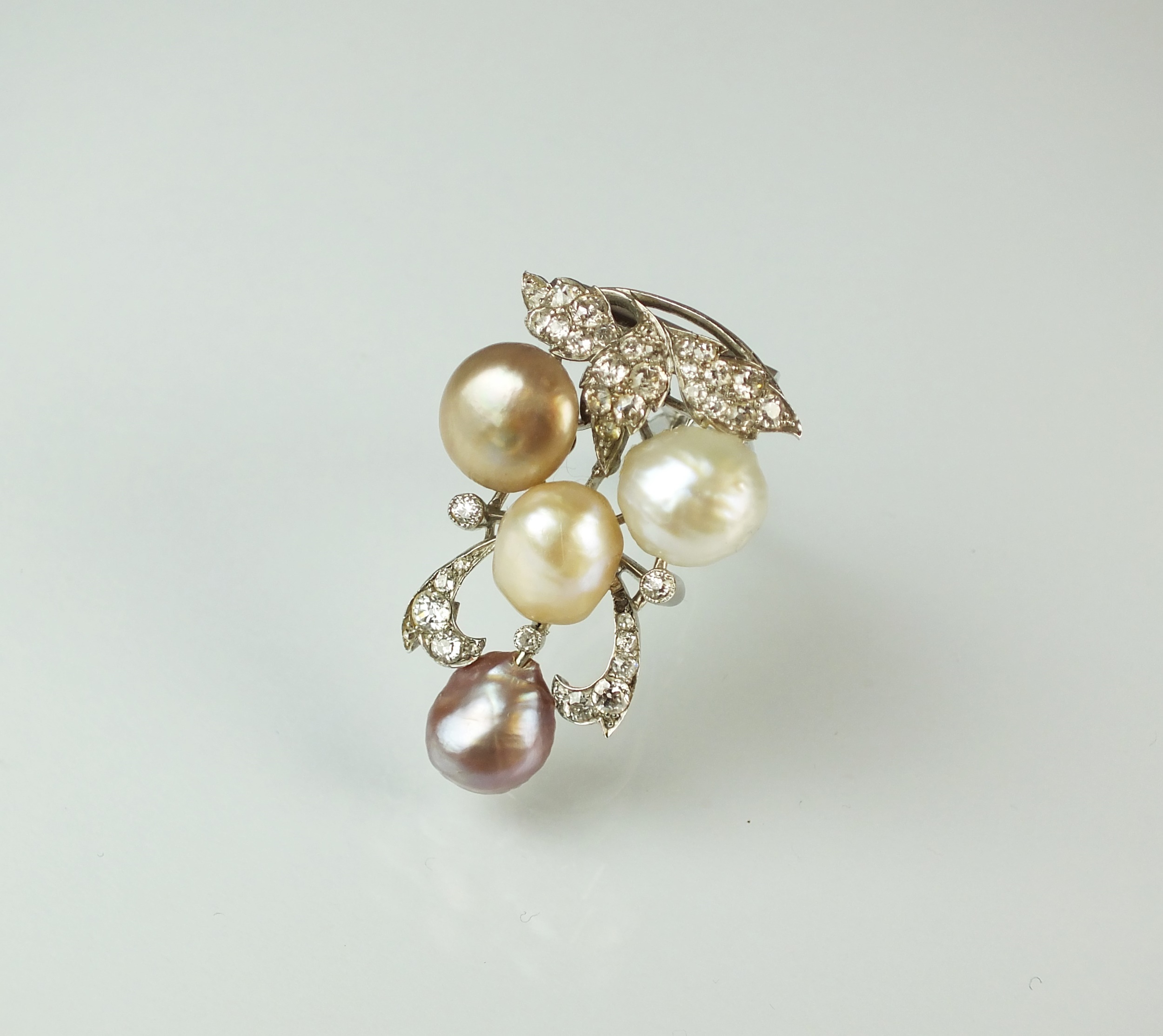 Lot 64 A diamond and pearl clip brooch