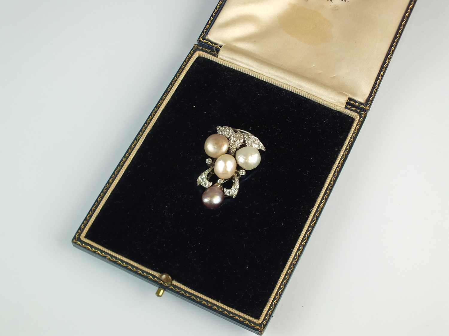 Lot 64 A diamond and pearl clip brooch